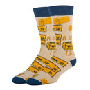Beige socks with yellow 'Butter in a Life' design and blue cuffs and toes on a white background